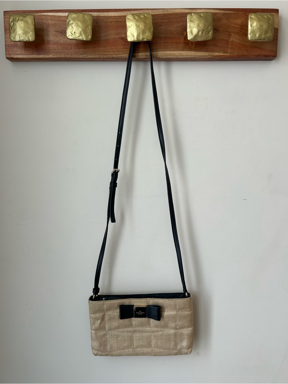 kate spade Metallic light Gold Crossbody with Black Bow Accent